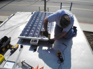 Solar panel on top of trailer Solar Forward crew installs a solar panel