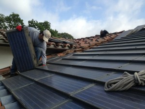 Replacing defective solar roofing tiles